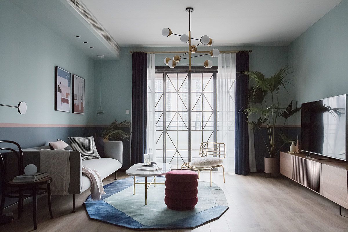 a bathroom with a large tub in the middle of it and a room next to a large window that has lots of a wooden flooring and dining room filled with white walls painted door, antique rug. Foyer Design,